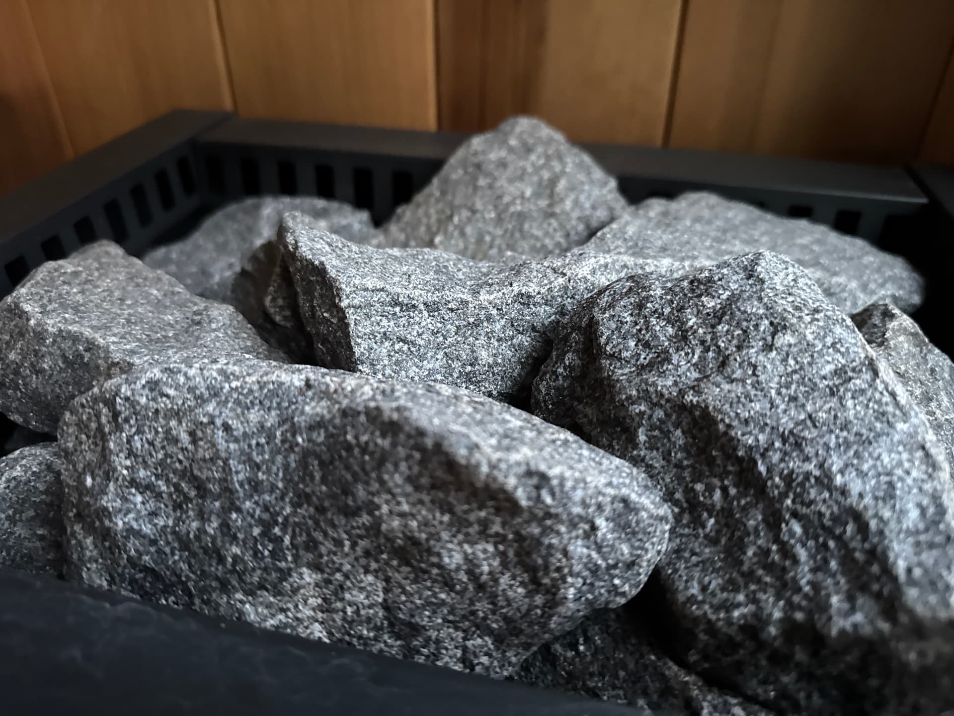 Sauna stones in the Harvia stove, ladle nearby, ready for löyly